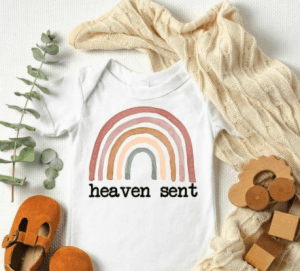 etsy boho rainbow body suit with the words heaven sent